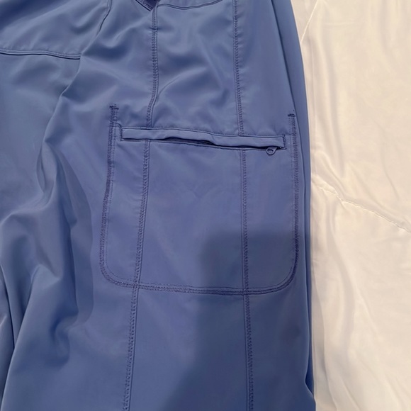 Pair of ceil blue scrubs, medium top and large bottom. See pictures for flaws. - Picture 9 of 11